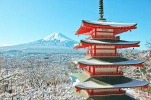 red and white pagoda temple near snow covered mountain in japan sp
