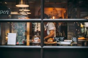 Woman in Restaurant Wearing Apron london uk sp