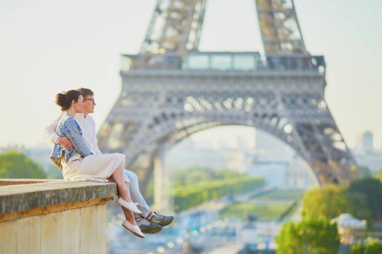 Happy romantic couple in Paris near the Eiffel tower