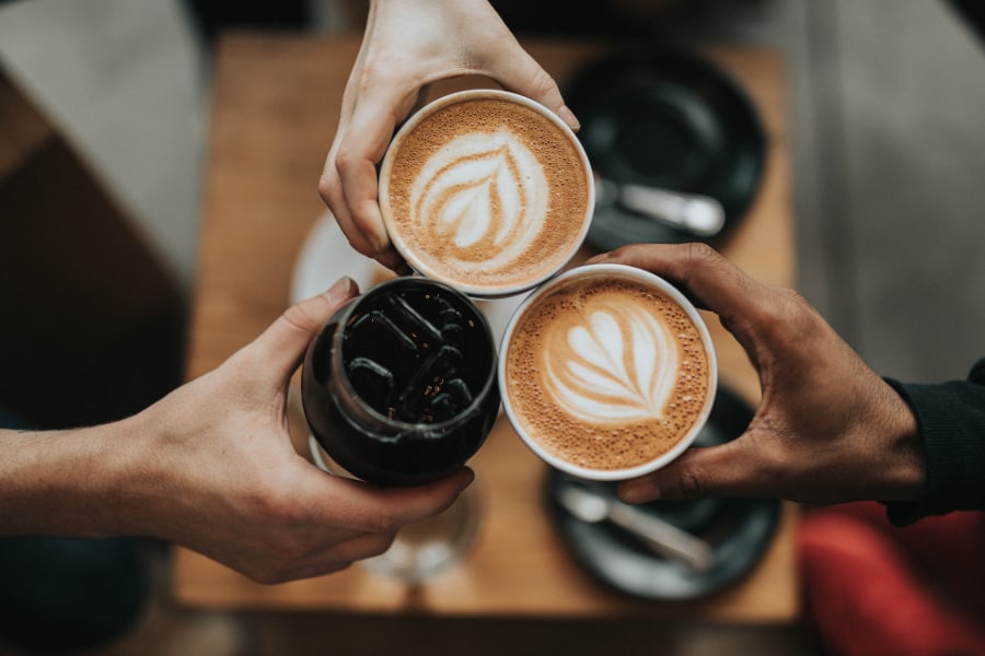 people holding coffee sp